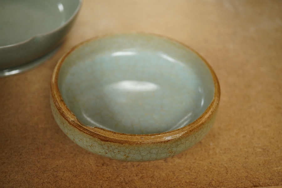 A Chinese celadon glazed box and cover and two similar bowls, largest 15cm diameter. Condition - varies